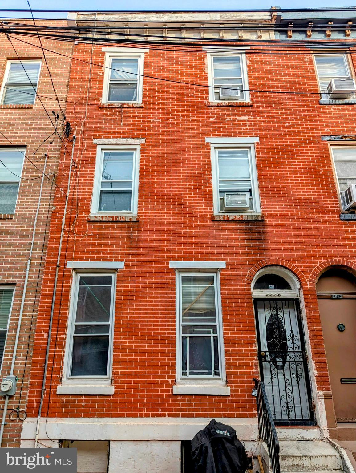 a front view of a building with many windows