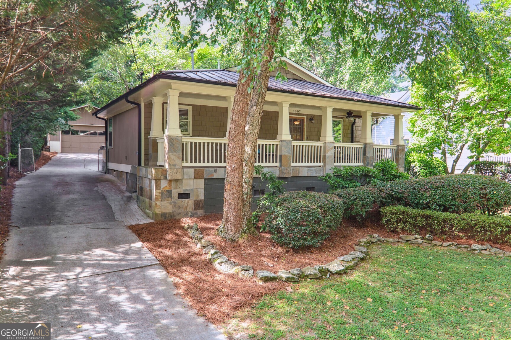 a front view of a house with garden