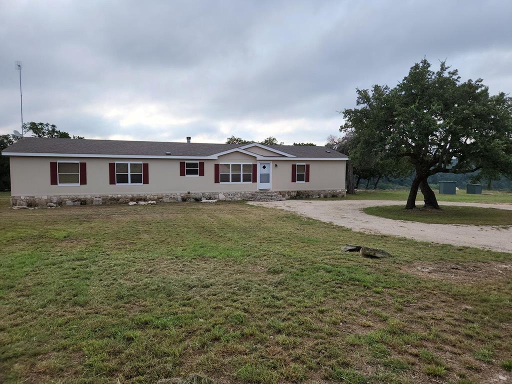 a view of a house with a yard