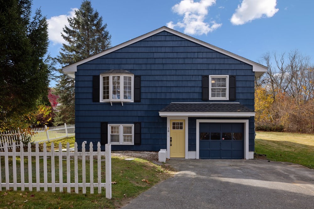 a front view of a house with a yard