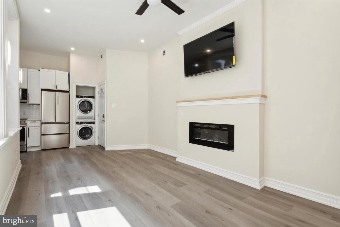 a view of a livingroom with a flat screen tv and fireplace