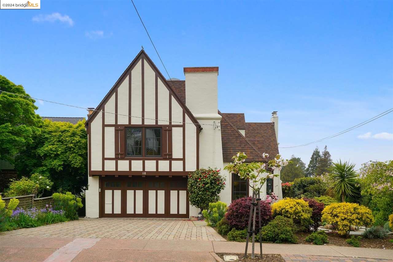 a view of a house with a garden and pathway