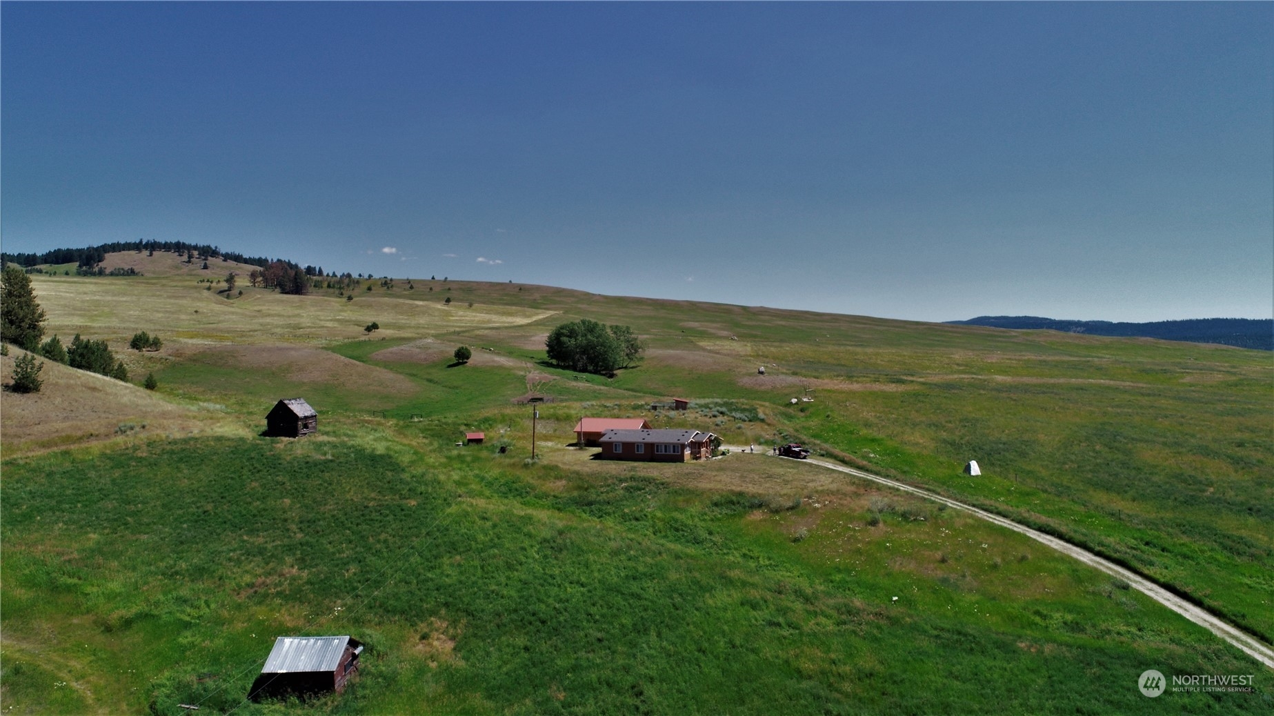 a view of a field with an ocean view