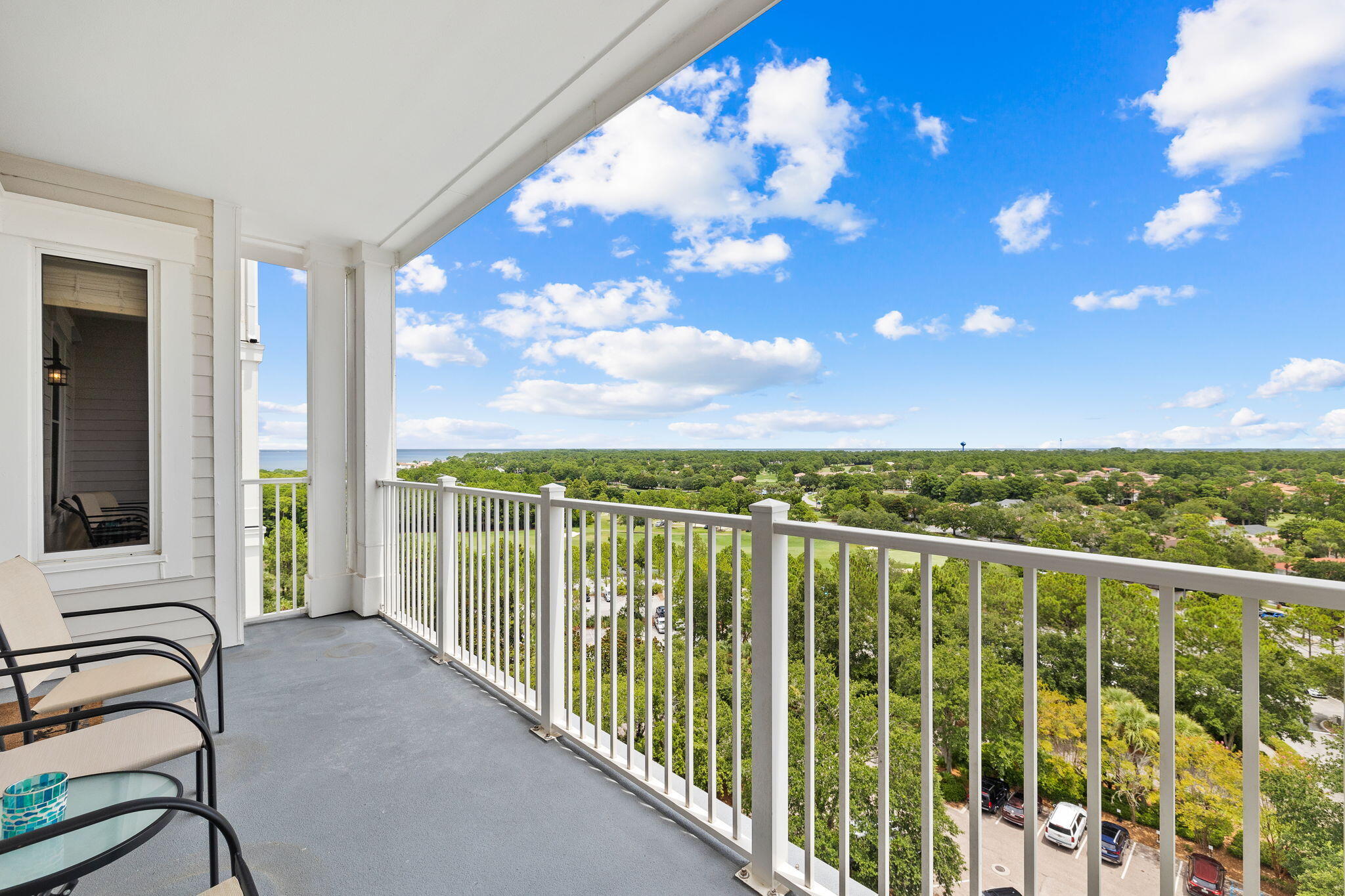 a view of a balcony with furniture