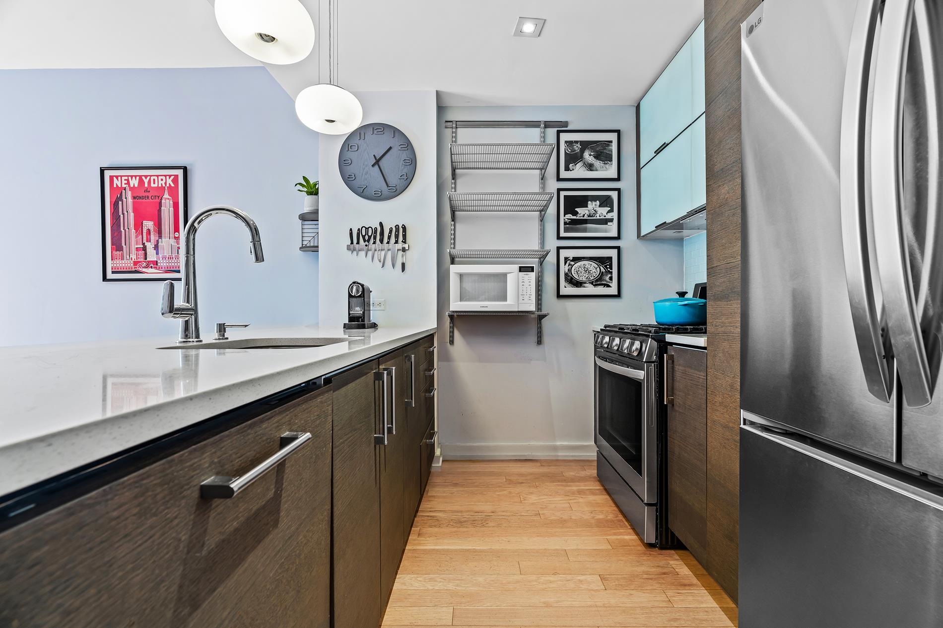 a kitchen with stainless steel appliances granite countertop a refrigerator and a sink