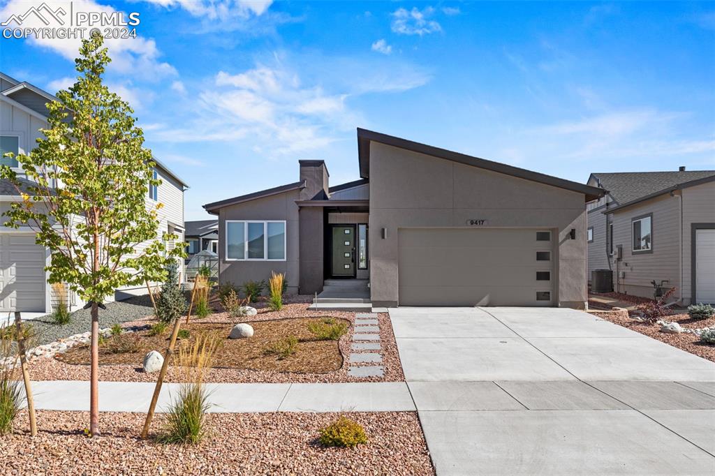 Contemporary home featuring a garage