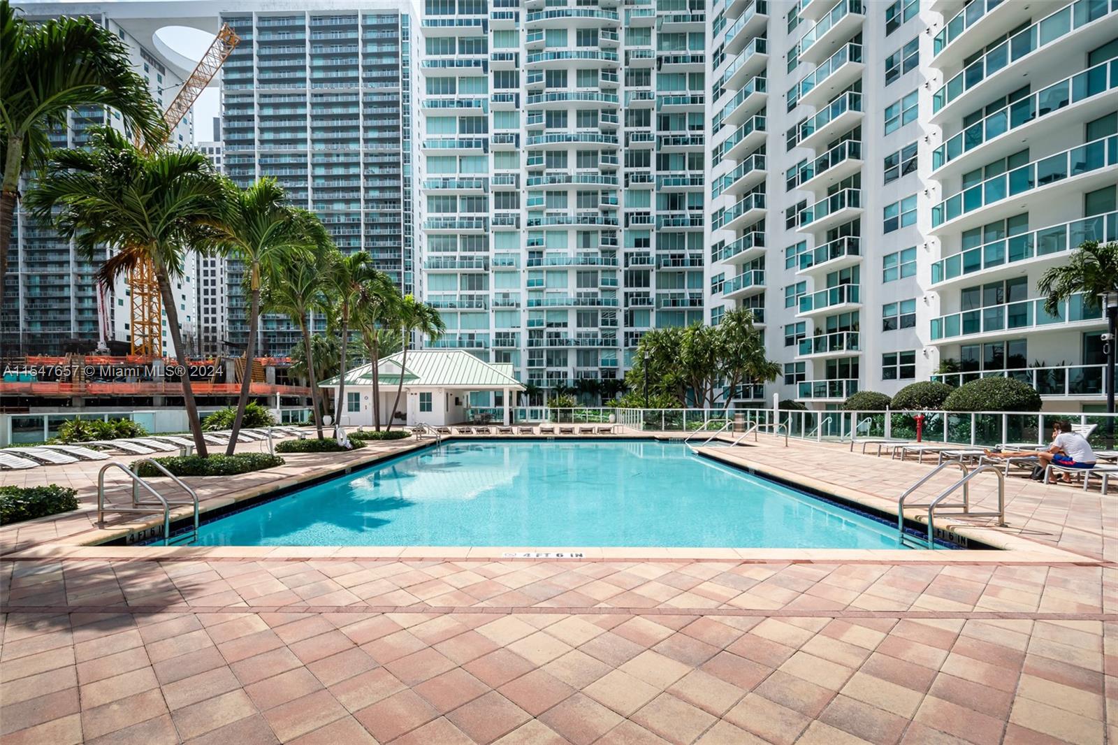 a view of swimming pool with outdoor seating