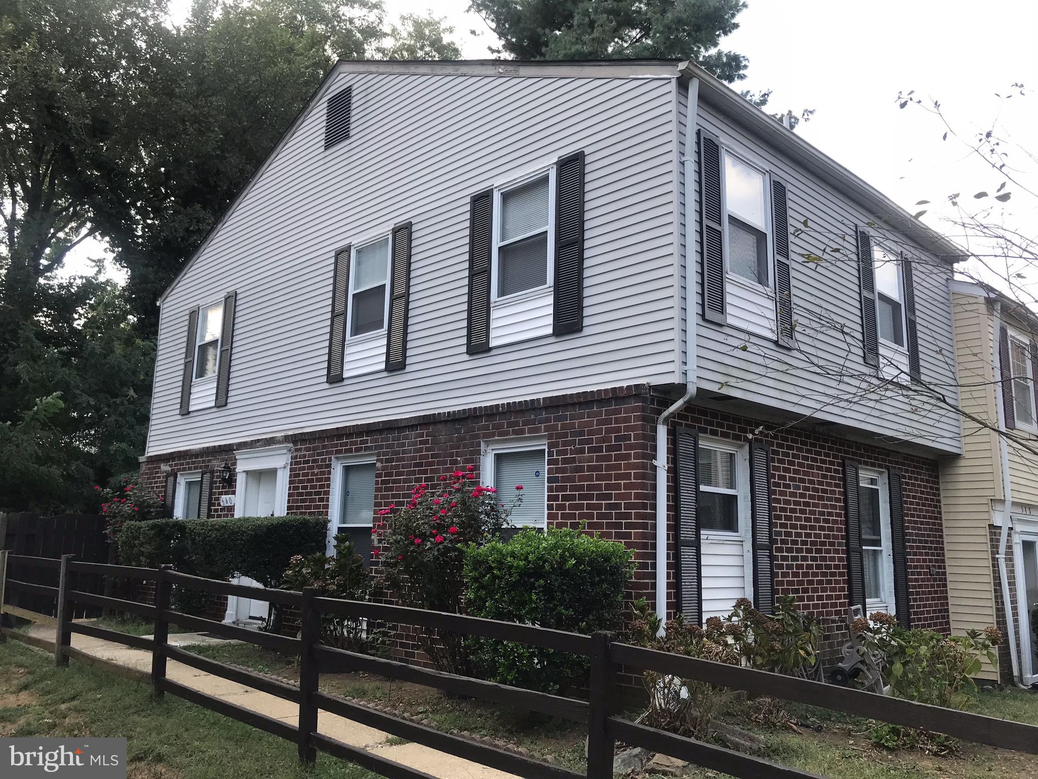 a front view of a house with yard