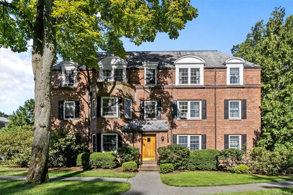 View of front of property with a front lawn