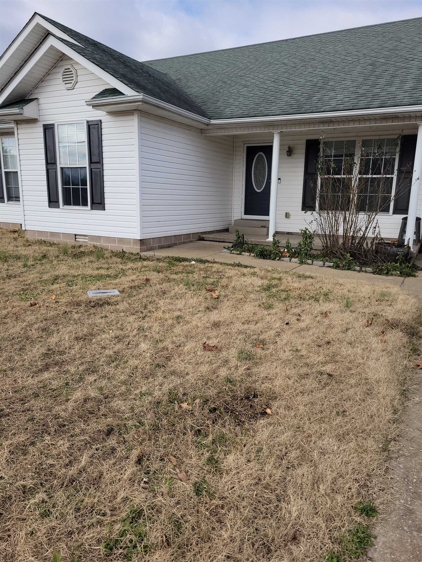 Ranch-style home with a front yard