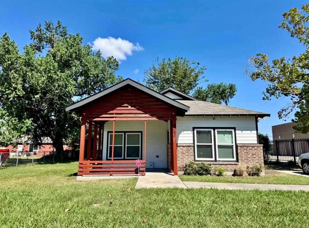 front view of a house with a yard