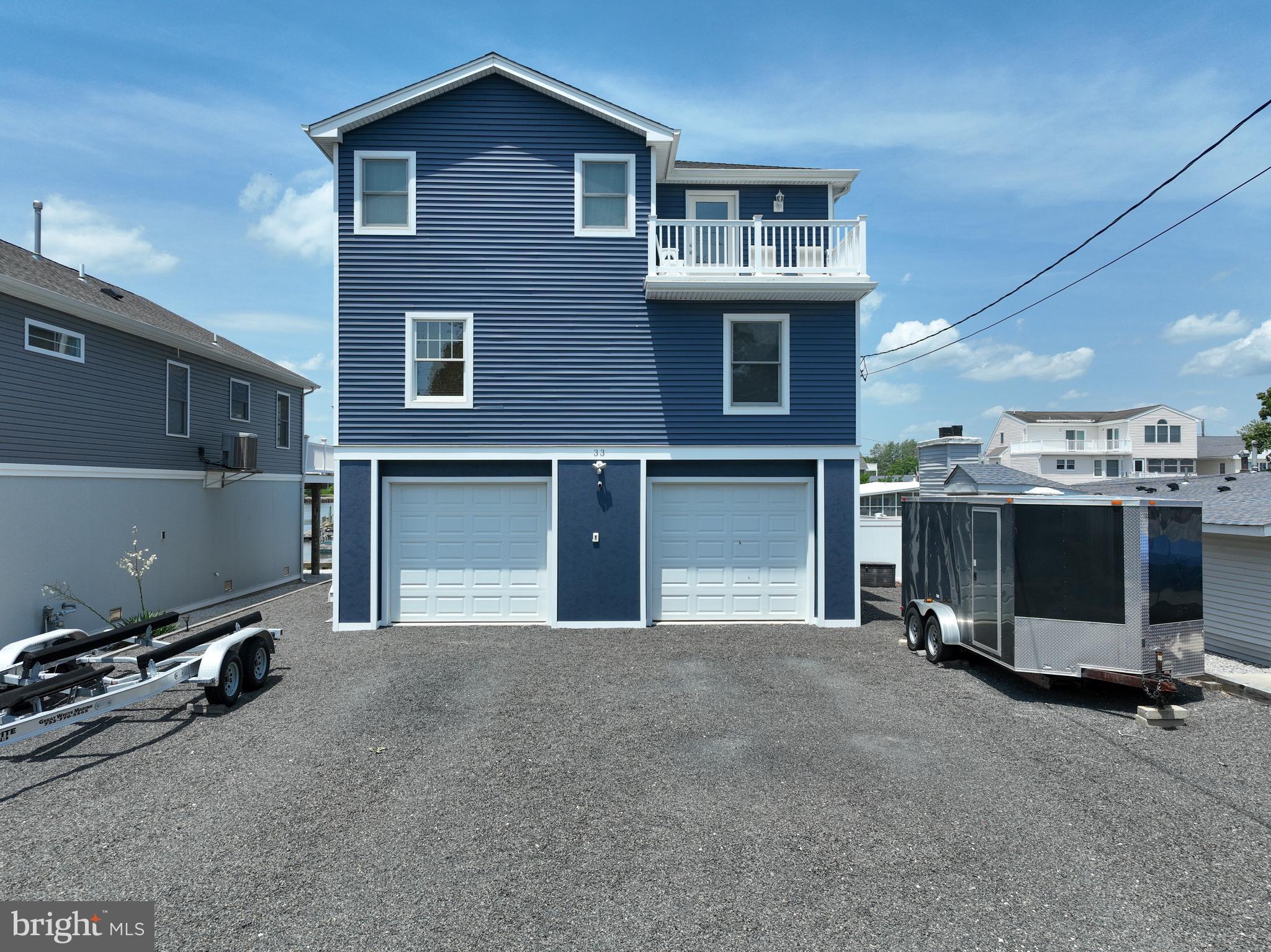 a view of a house with a garage and car parked