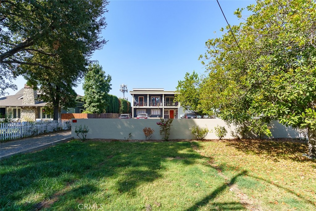 a front view of a house with a yard and a porch