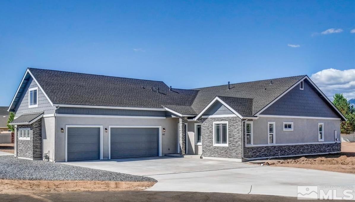 a front view of a house with a garage