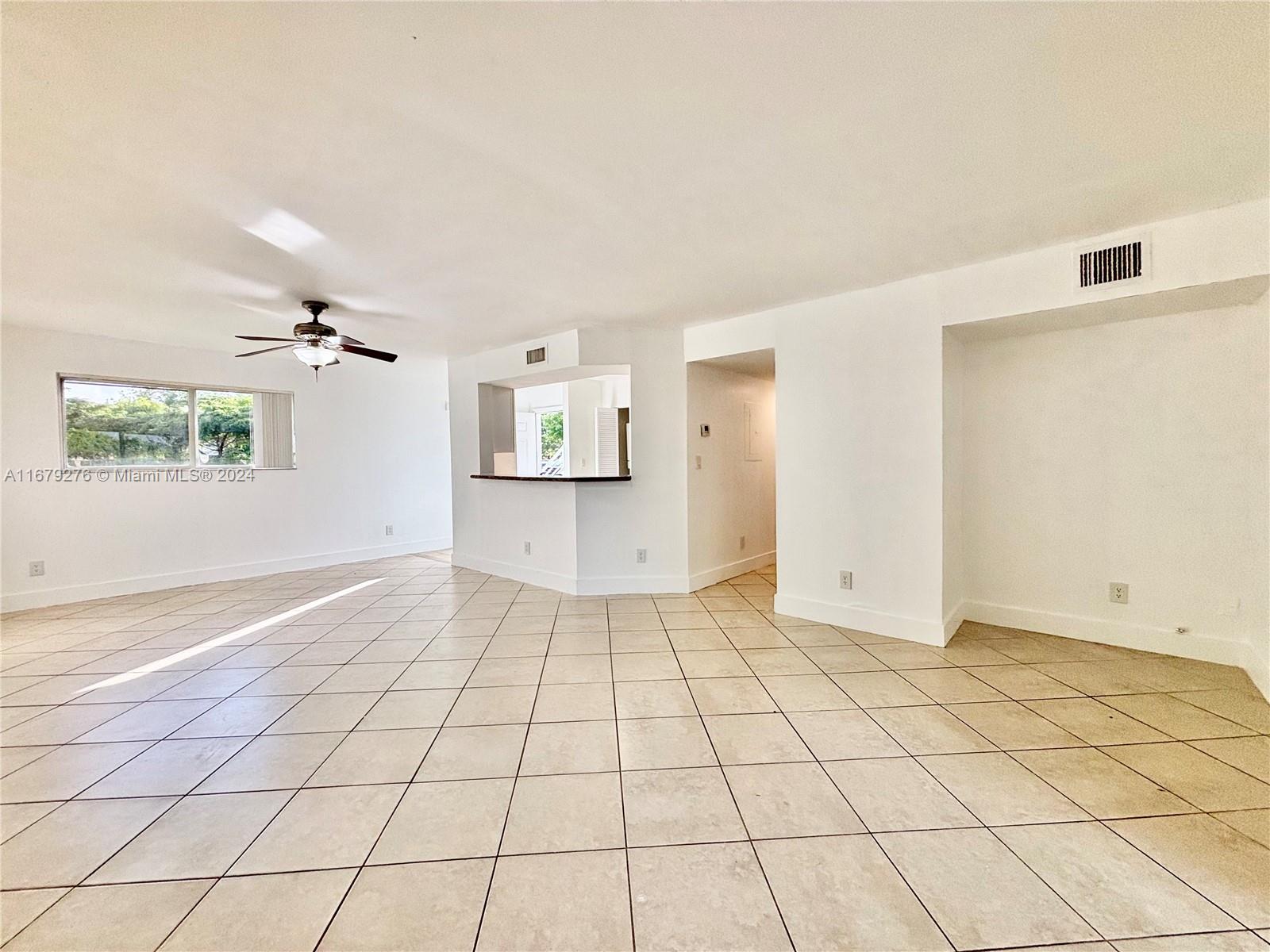 a view of an empty room and window