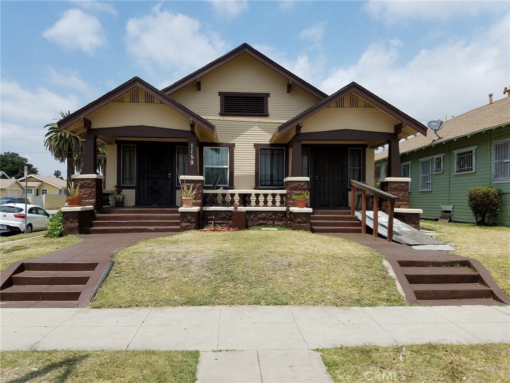 a view of a house with sitting area and furniture