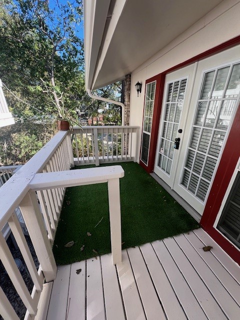 a view of balcony with wooden floor