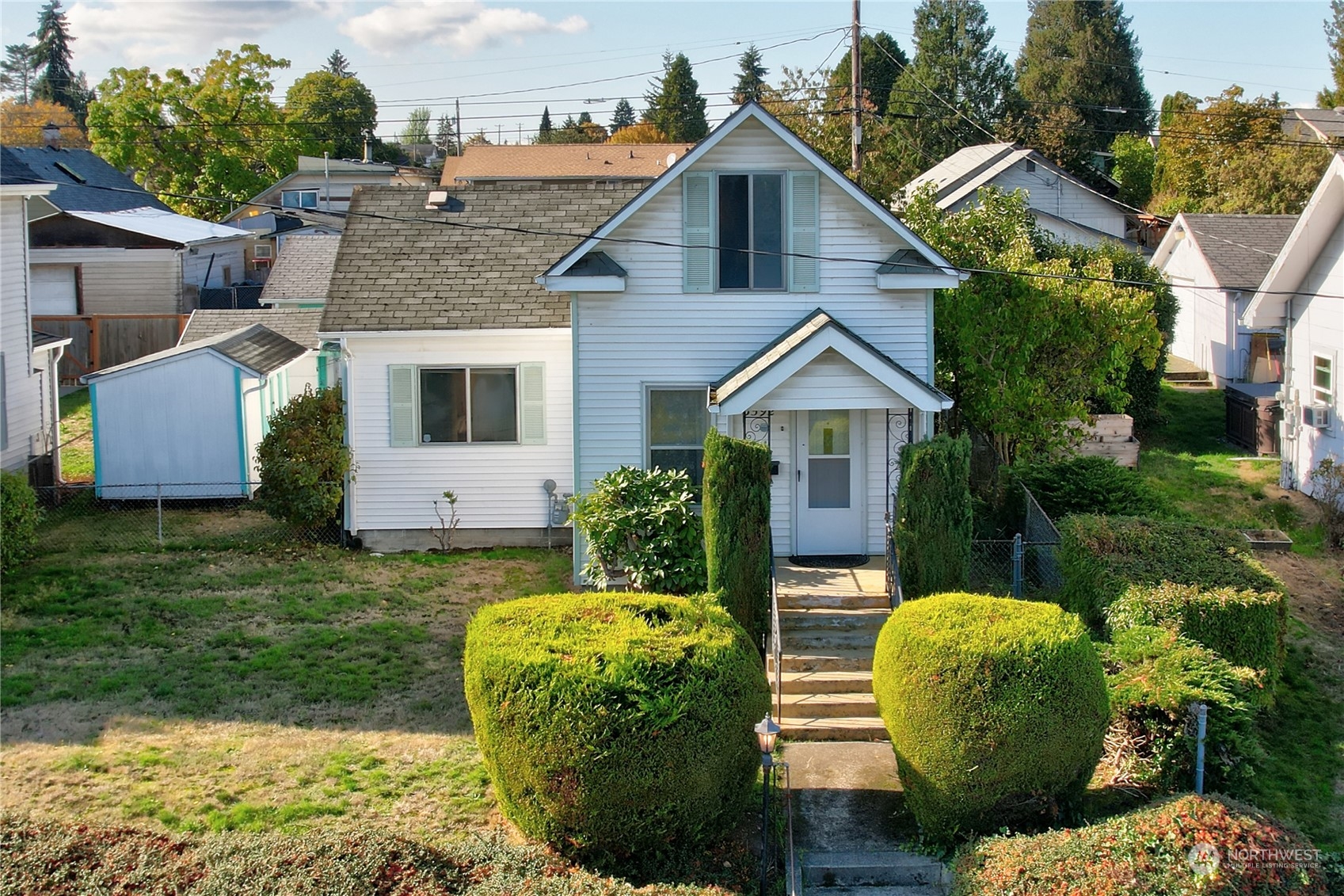 a front view of a house with garden