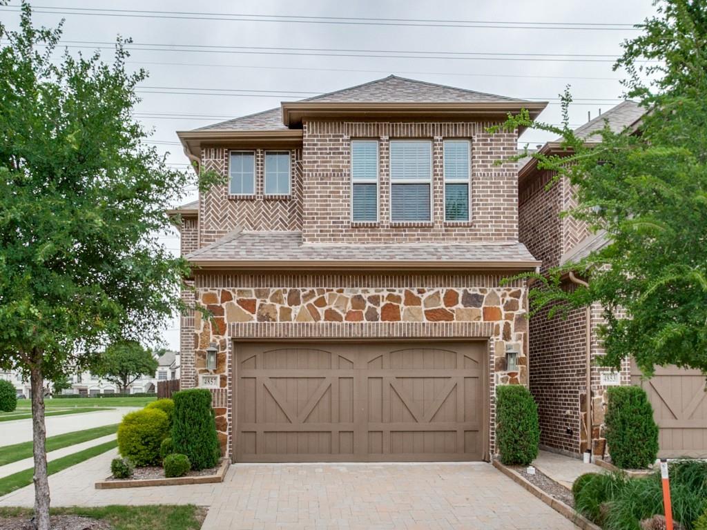 a front view of a house with a garage