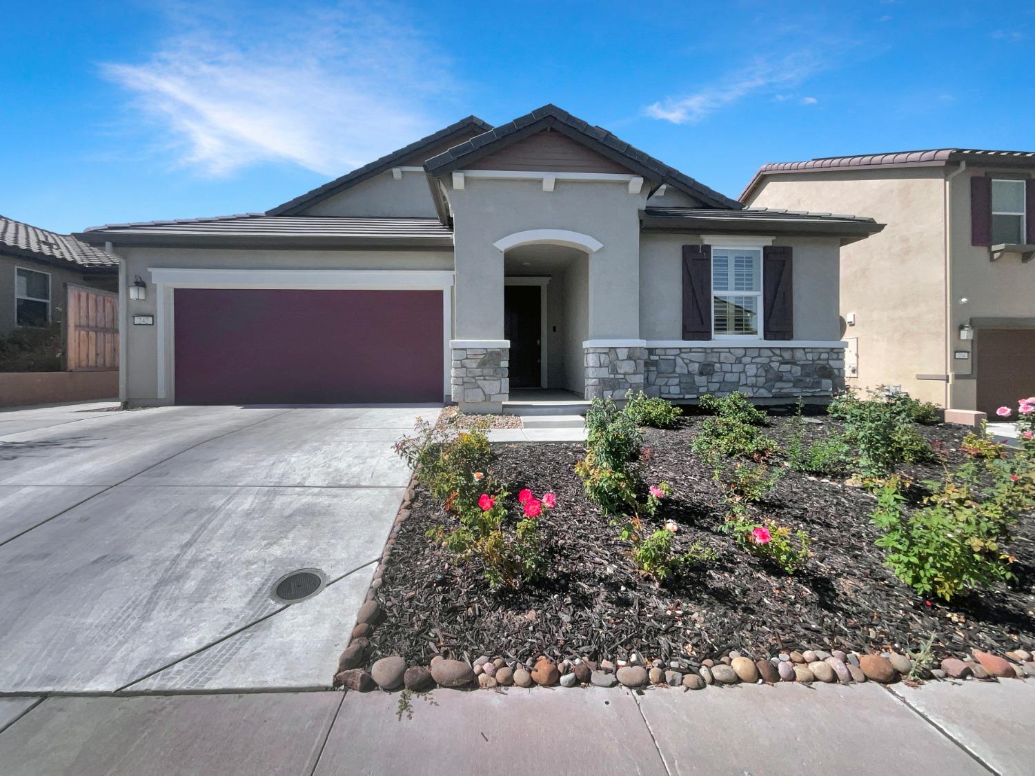 front view of a house with a small yard