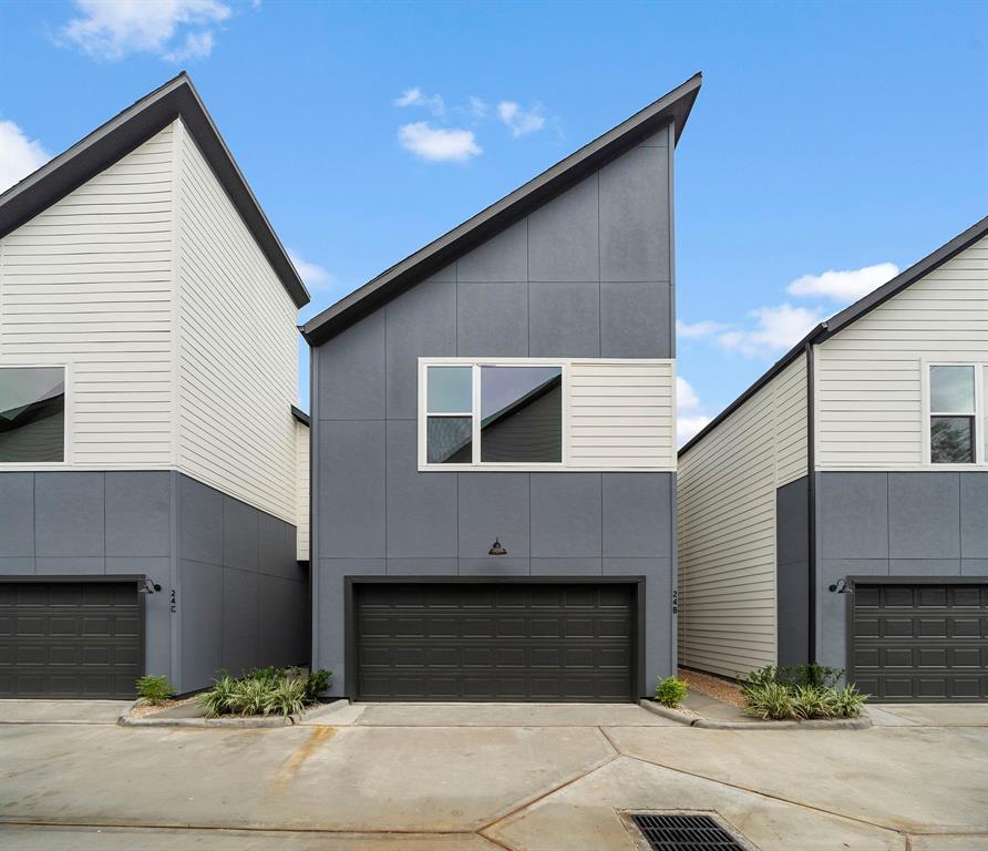 a front view of a house with garage