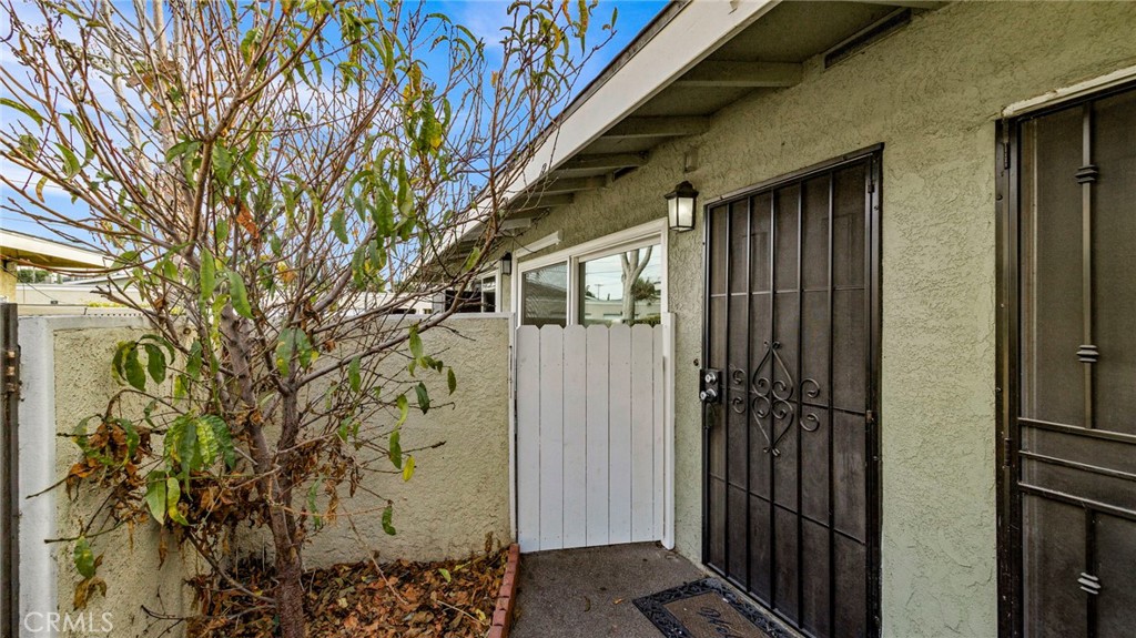 a door of a house with wooden fence