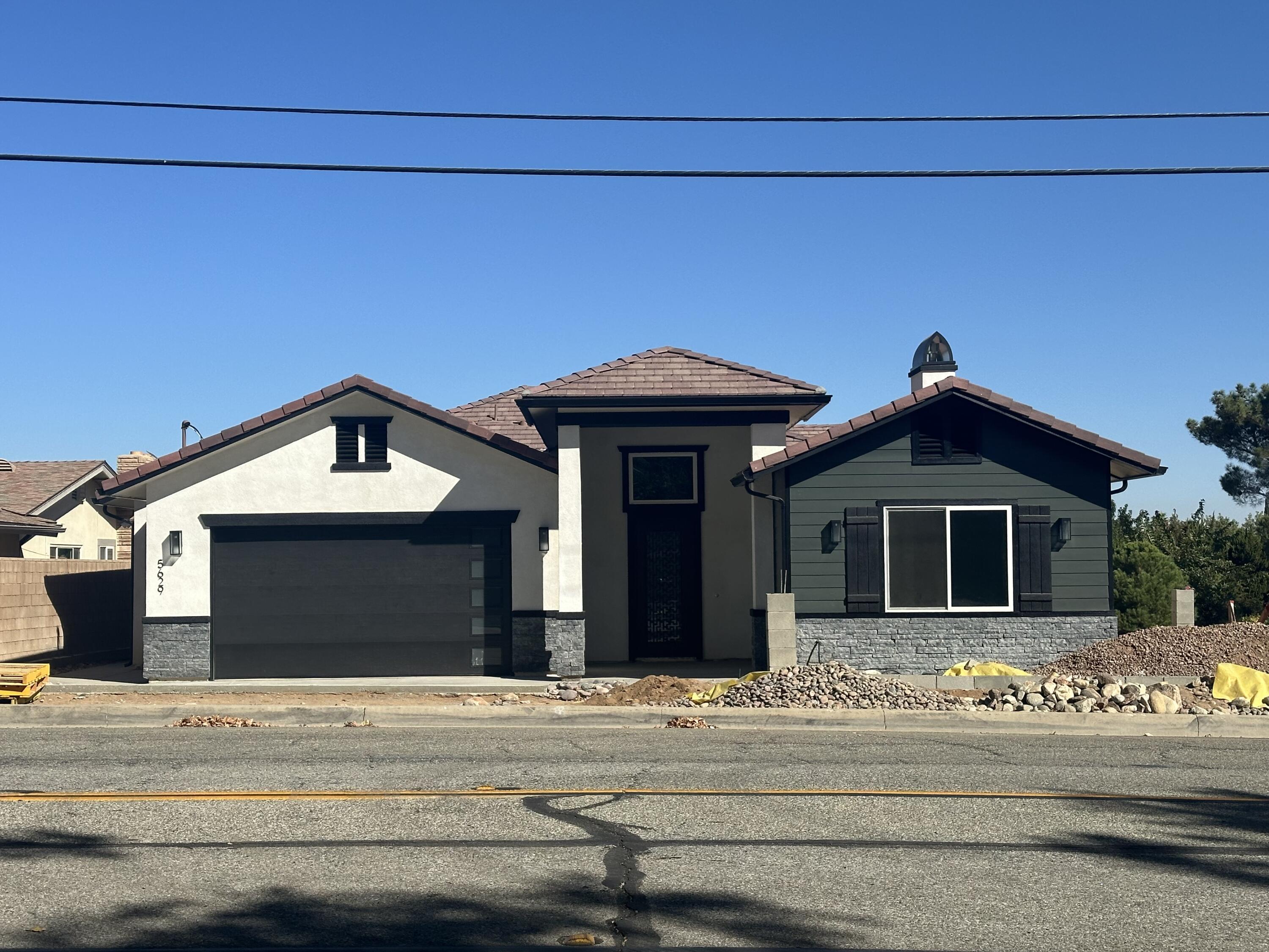 a front view of a house with a garage