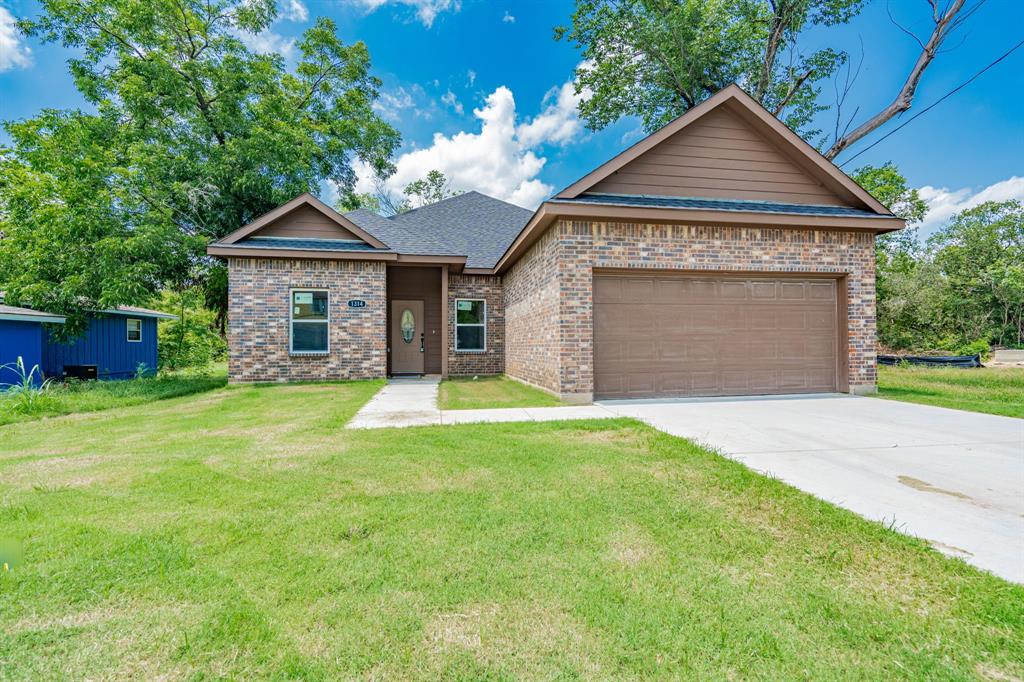 front view of a house with a yard