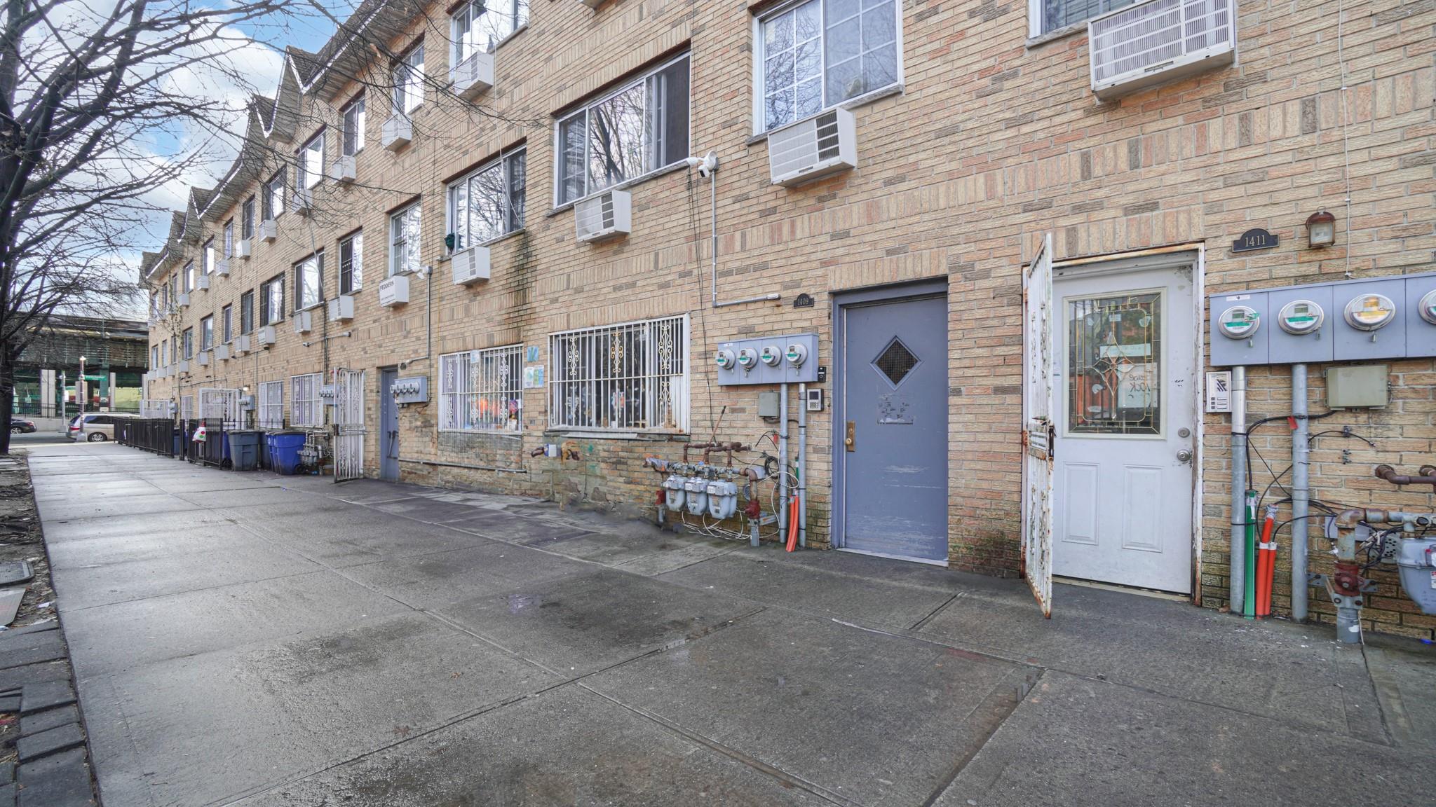 a view of a building with car parked