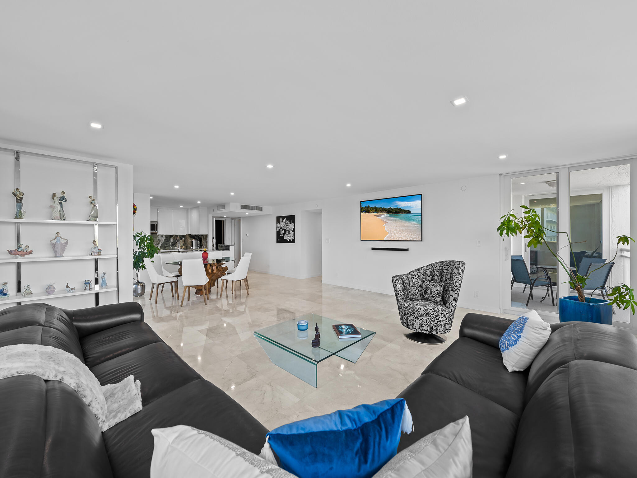 a living room with furniture and white walls