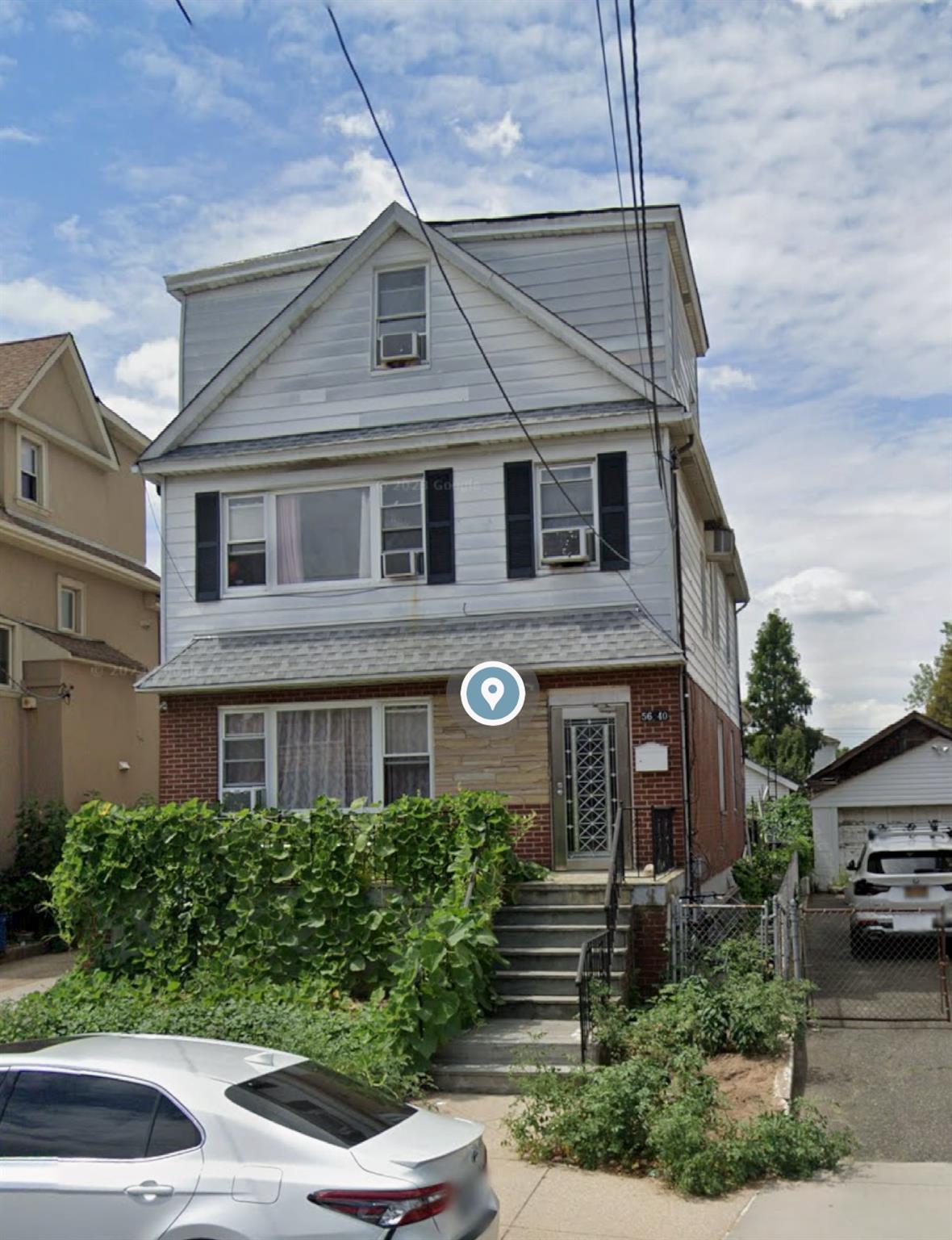 View of front of home with cooling unit