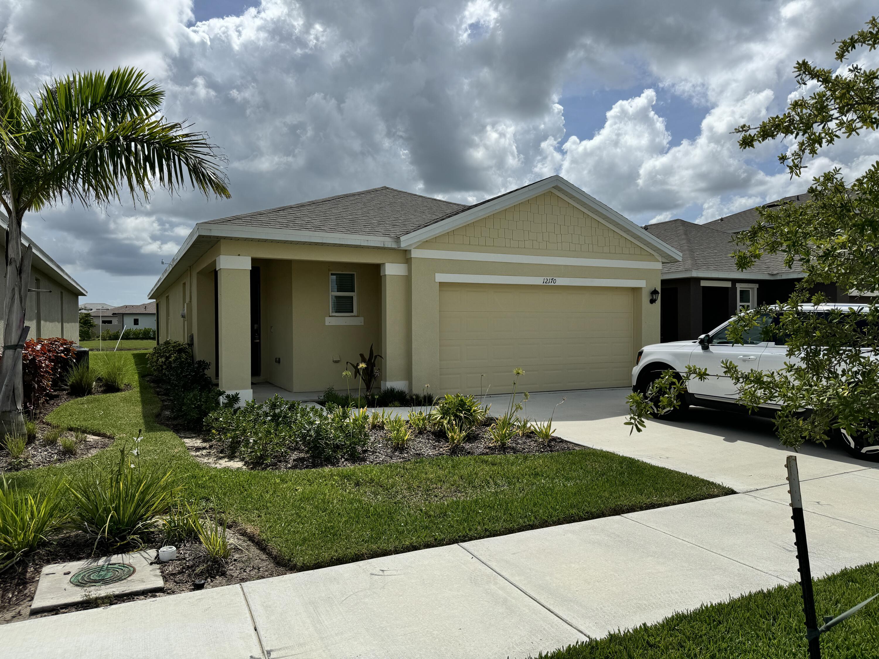 a front view of a house with garden