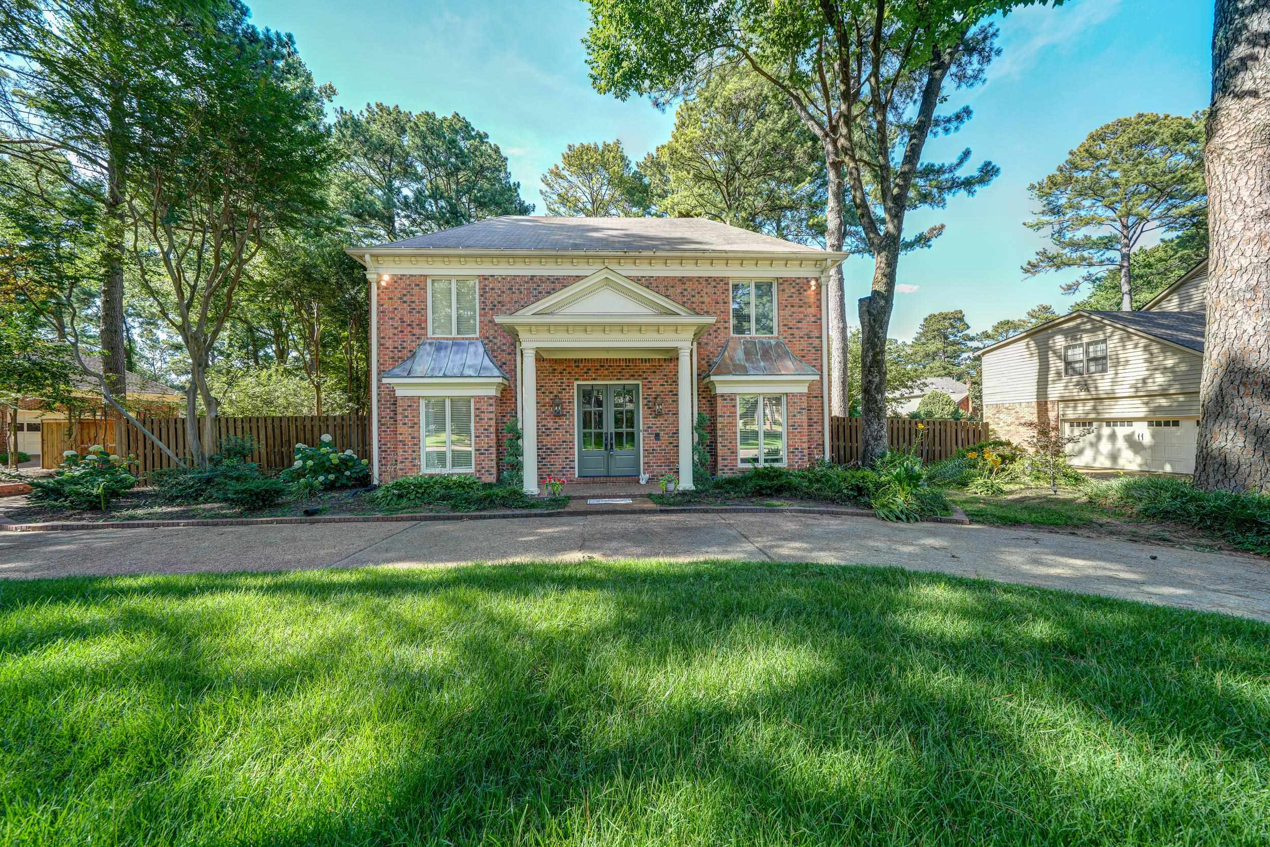 front view of a house with a yard