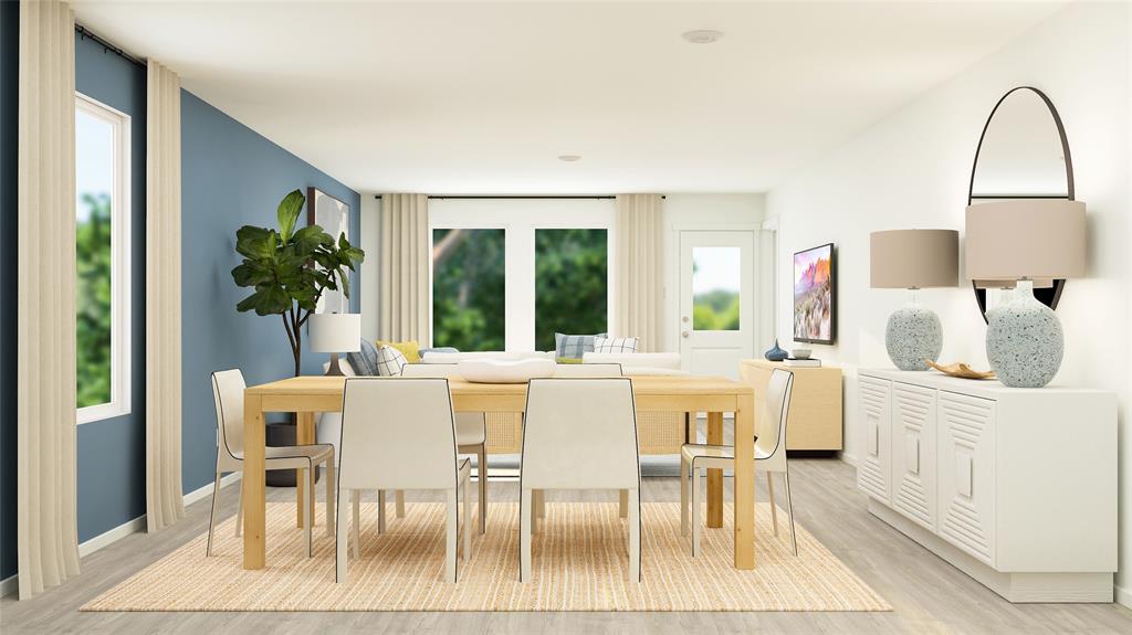 a view of a dining room with furniture and a potted plant