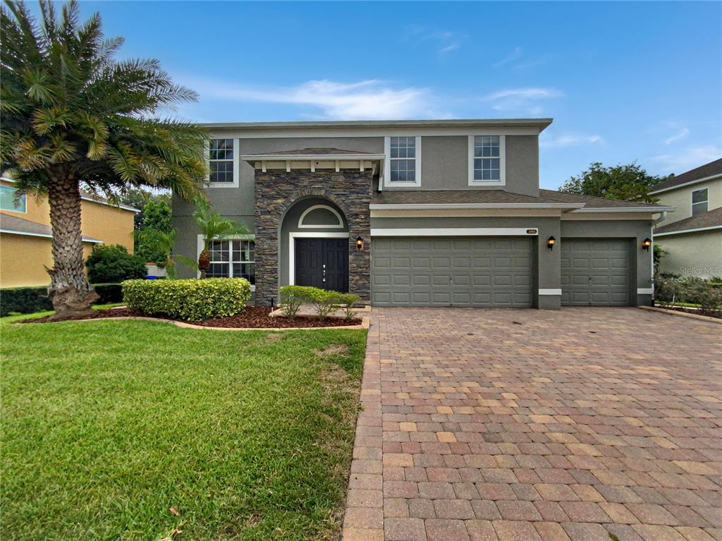 front view of a house with a yard