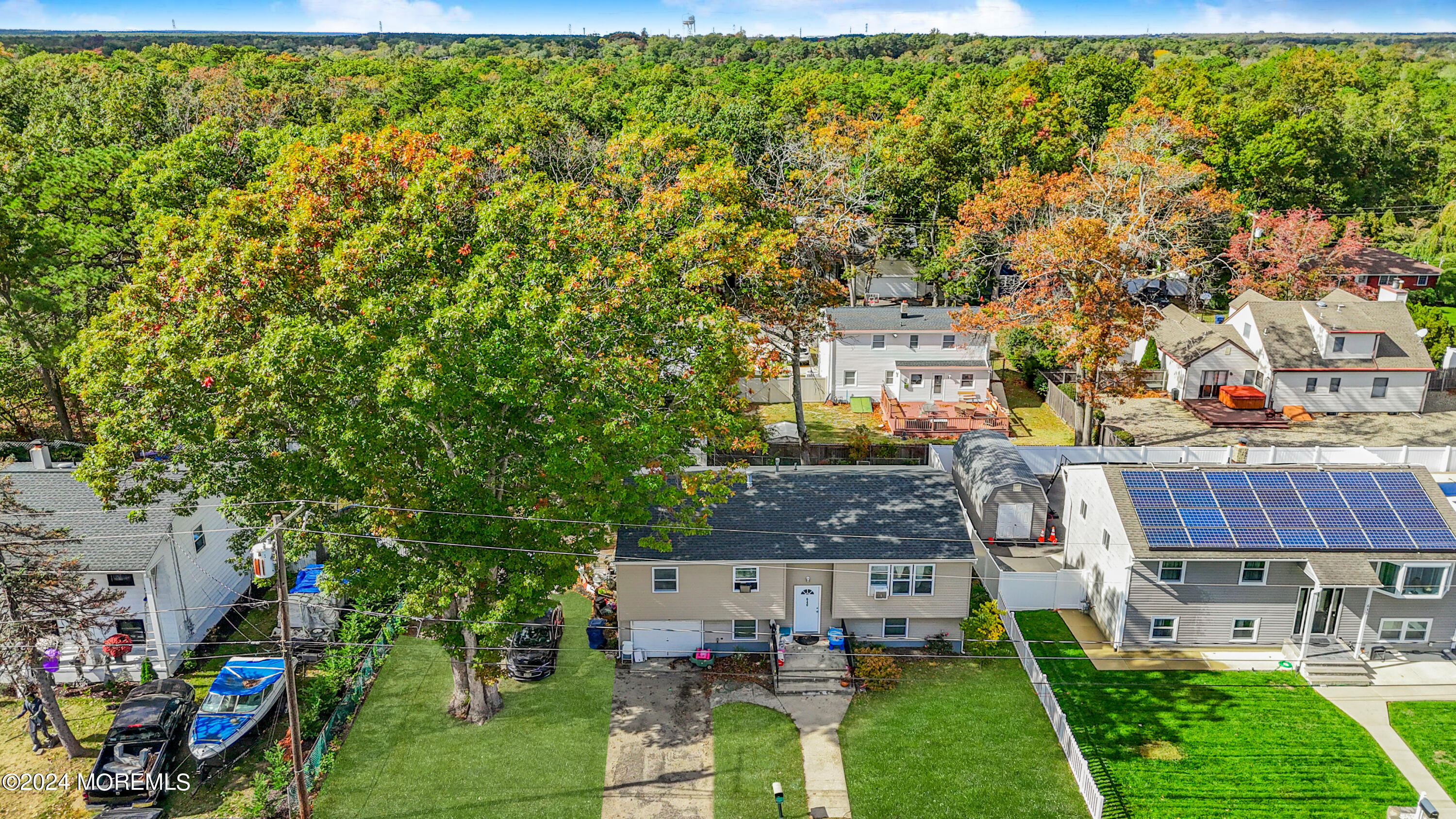 a aerial view of a house with a yard