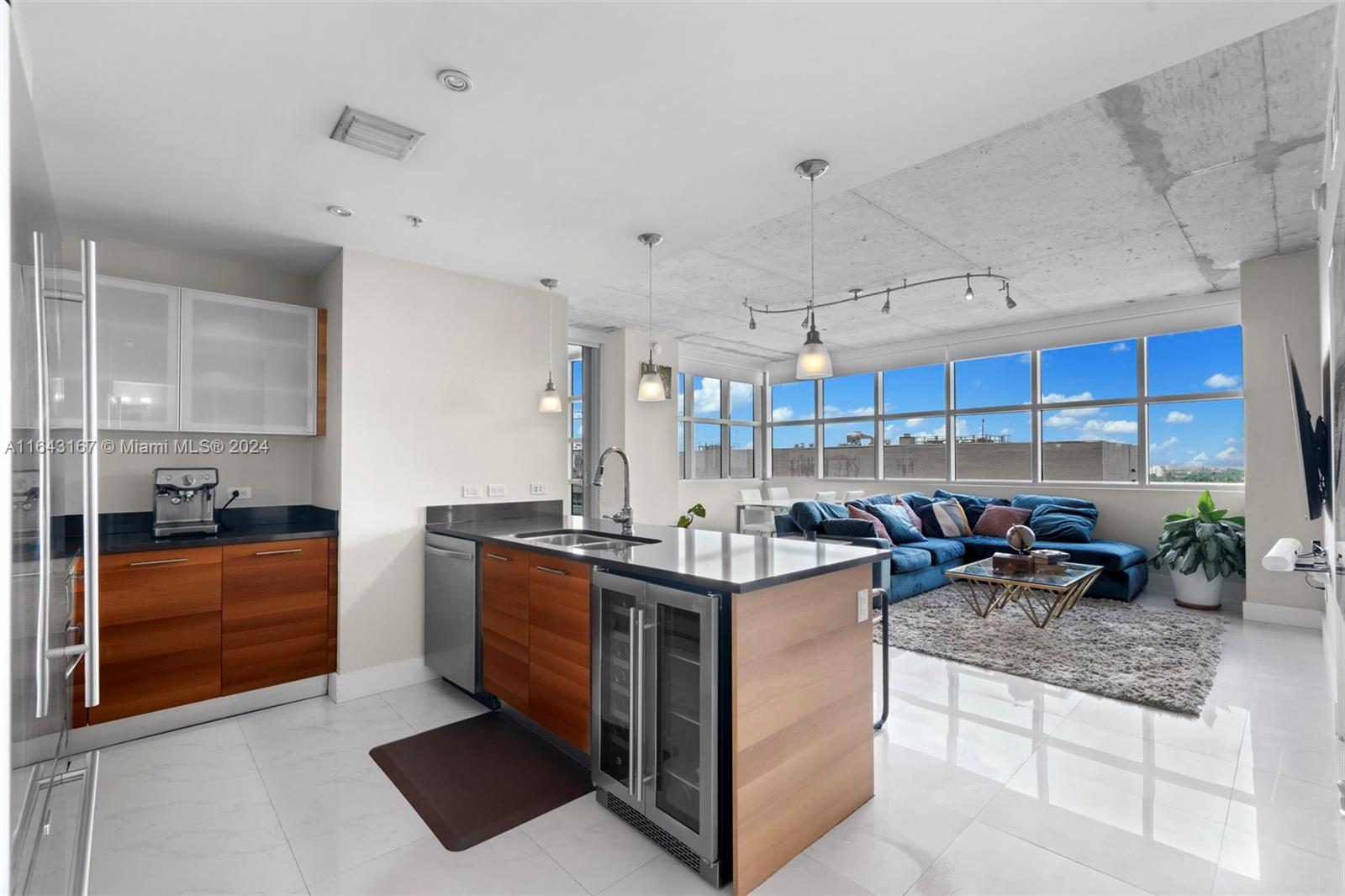 a kitchen with stainless steel appliances granite countertop a stove and a sink