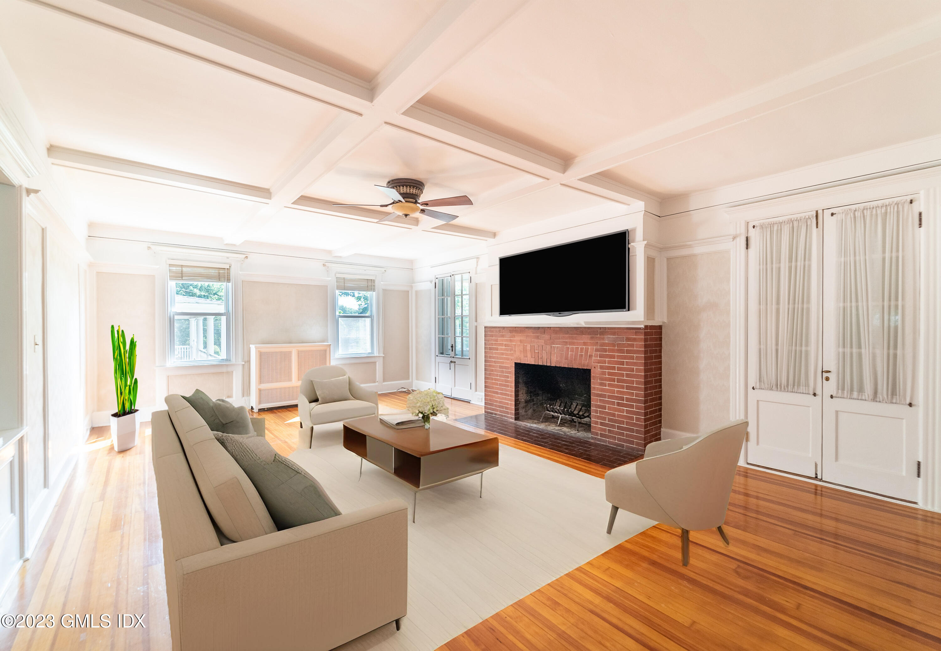 a living room with furniture fireplace and a flat screen tv