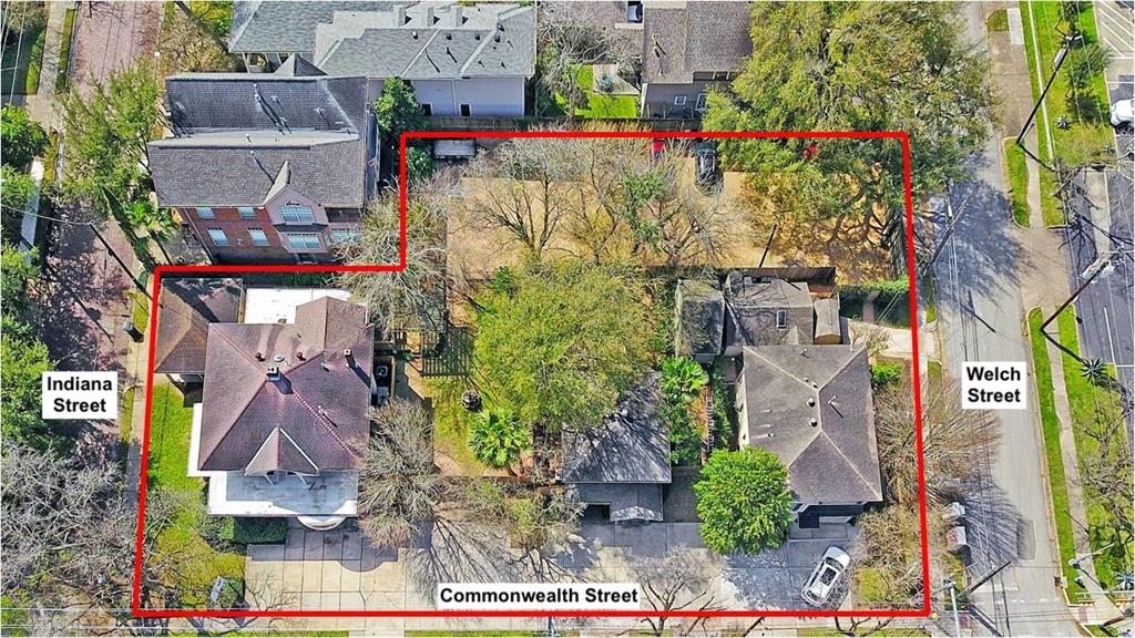 an aerial view of residential houses and outdoor space