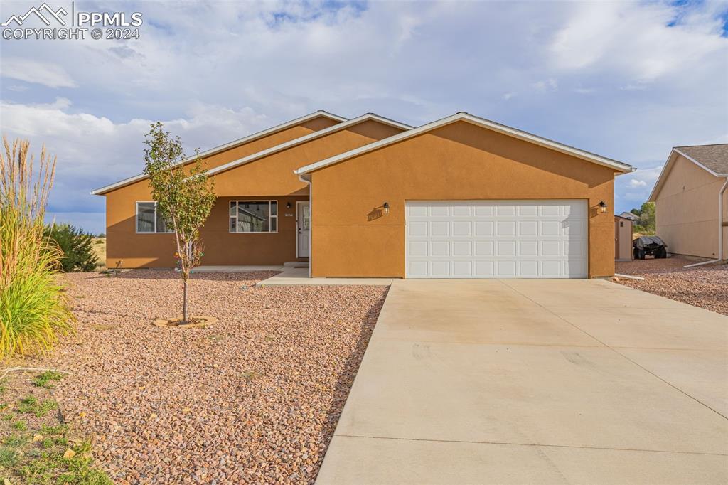 a front view of a house with a garage