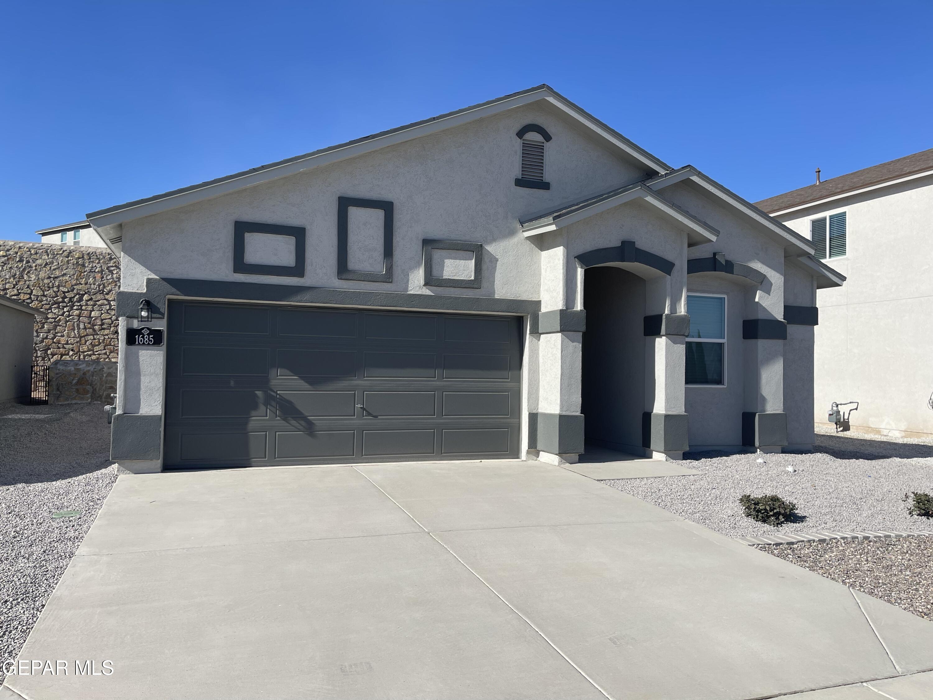 a front view of a house with a big yard