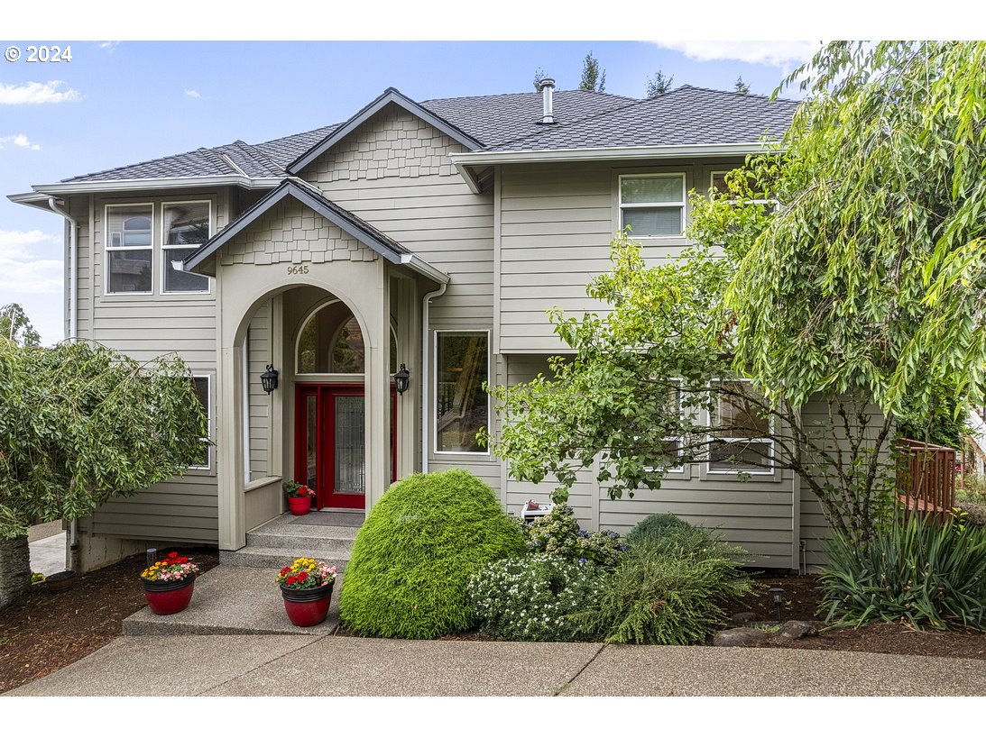 a front view of a house with garden