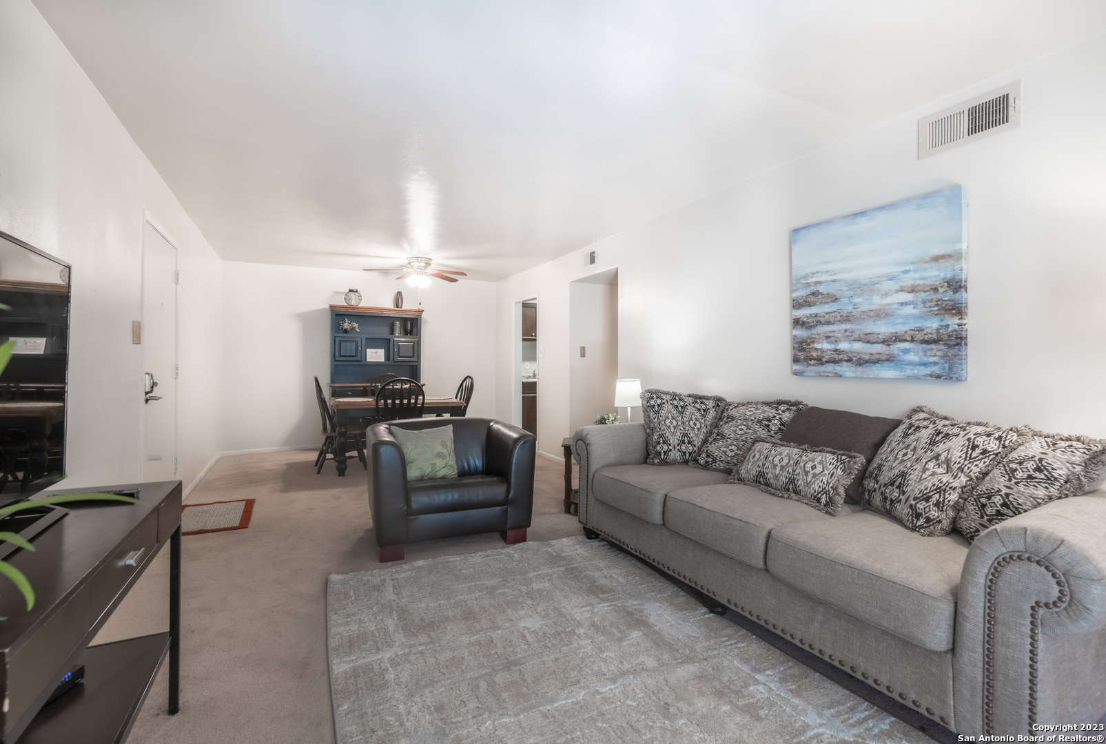 a living room with furniture and a couch