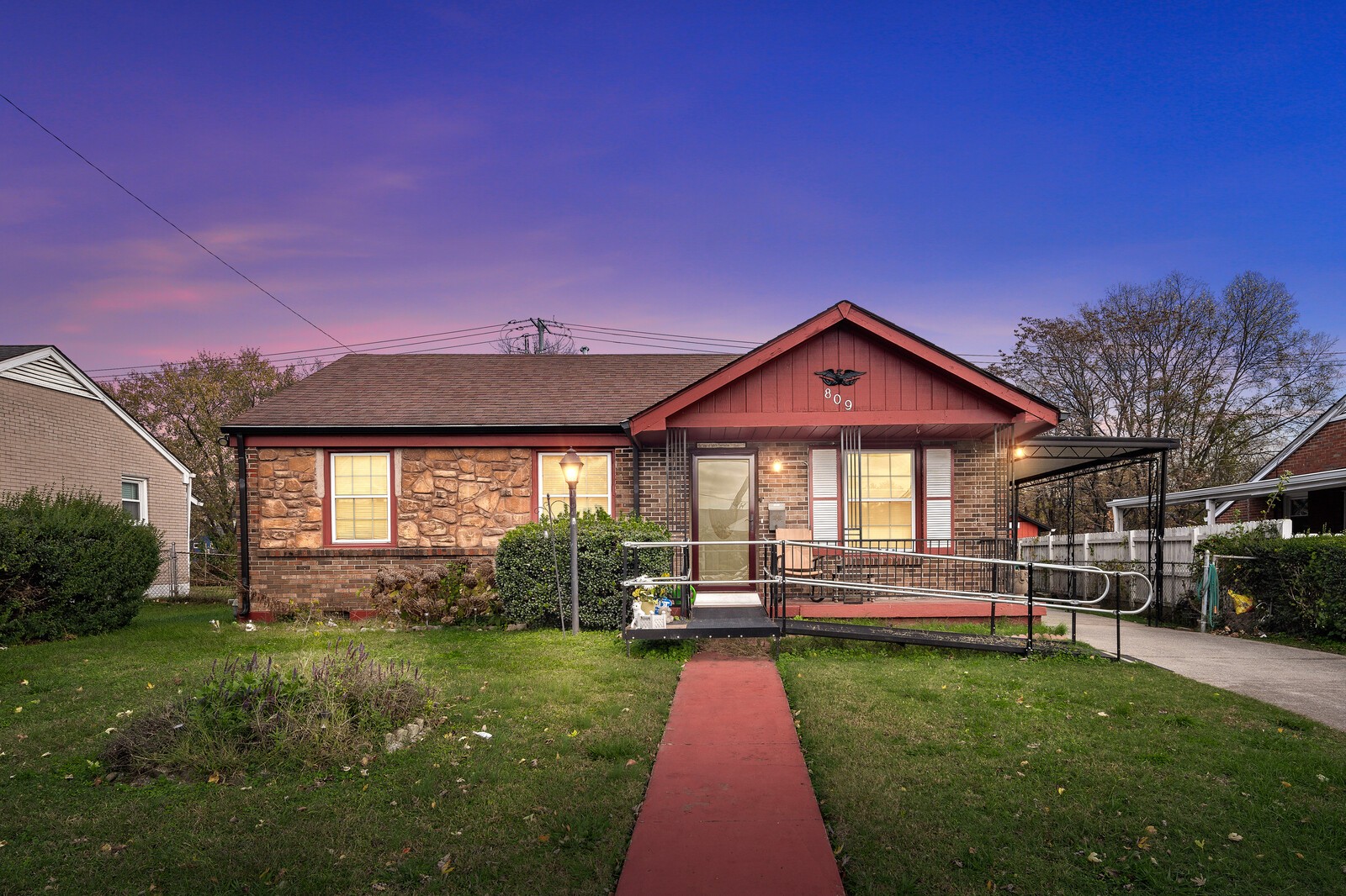 a view of a house with backyard and porch