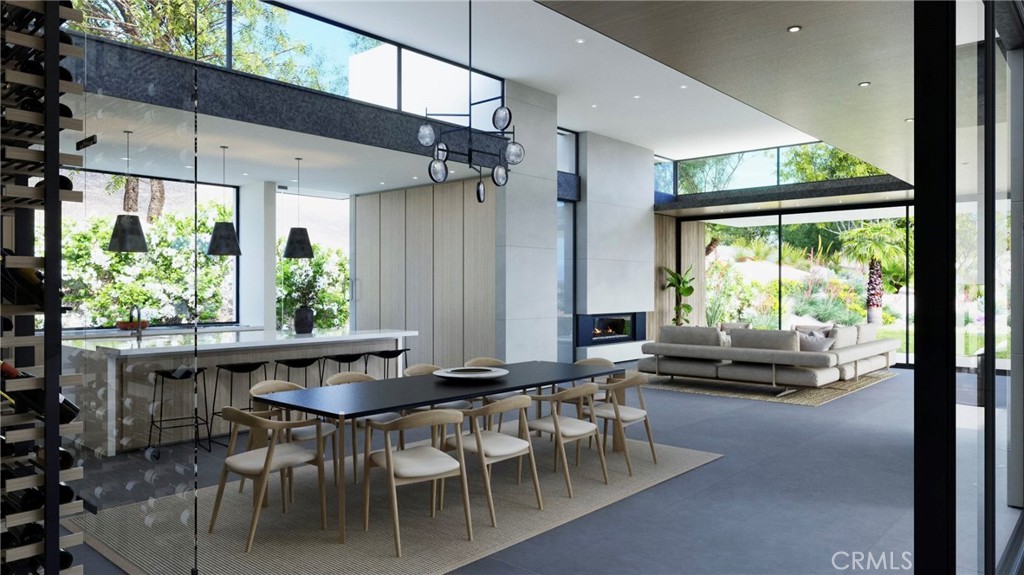 a dining room with furniture window outside view and wooden floor