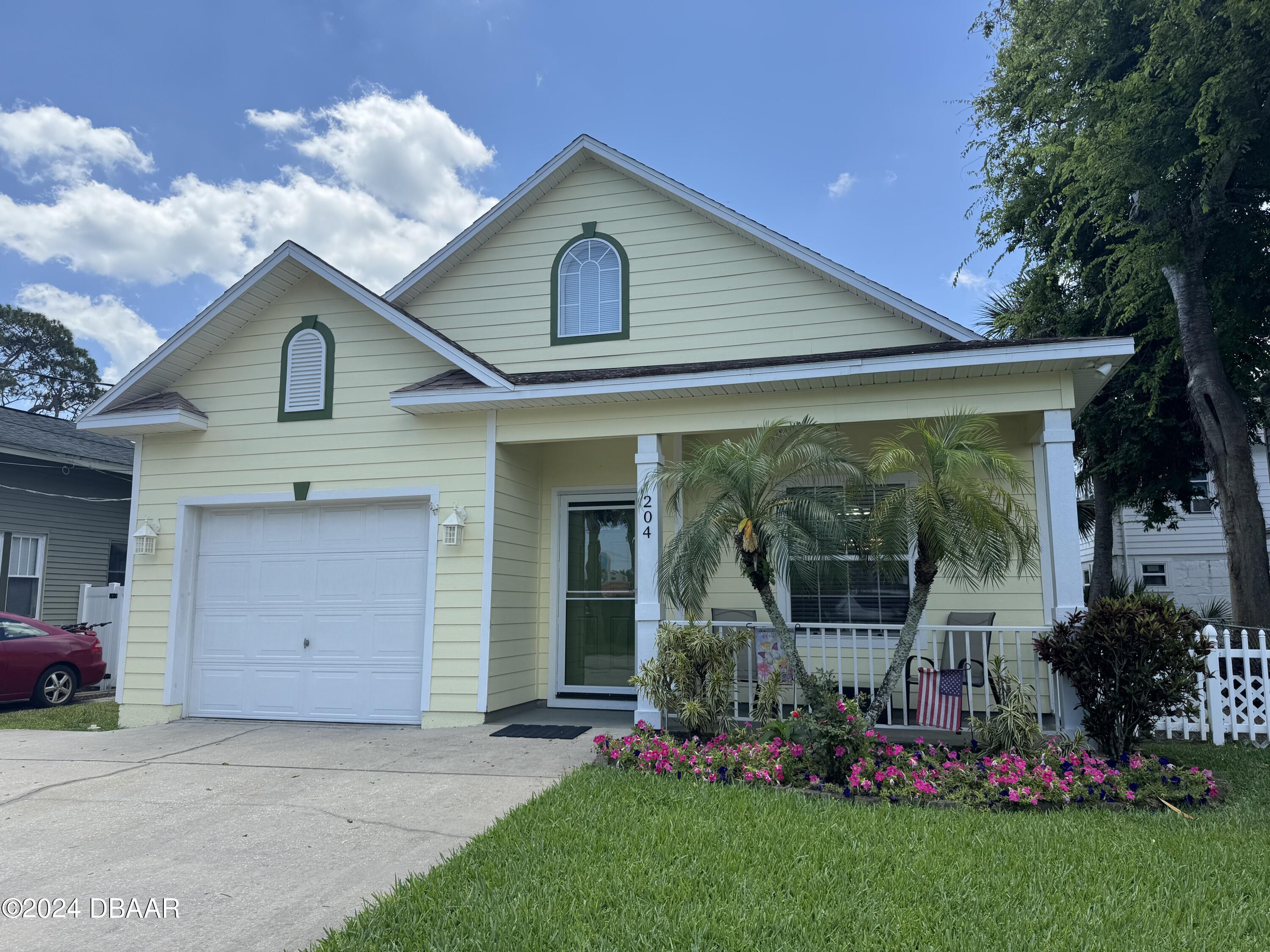 front view of a house with a yard