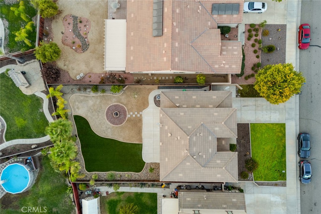 an aerial view of a house with a swimming pool