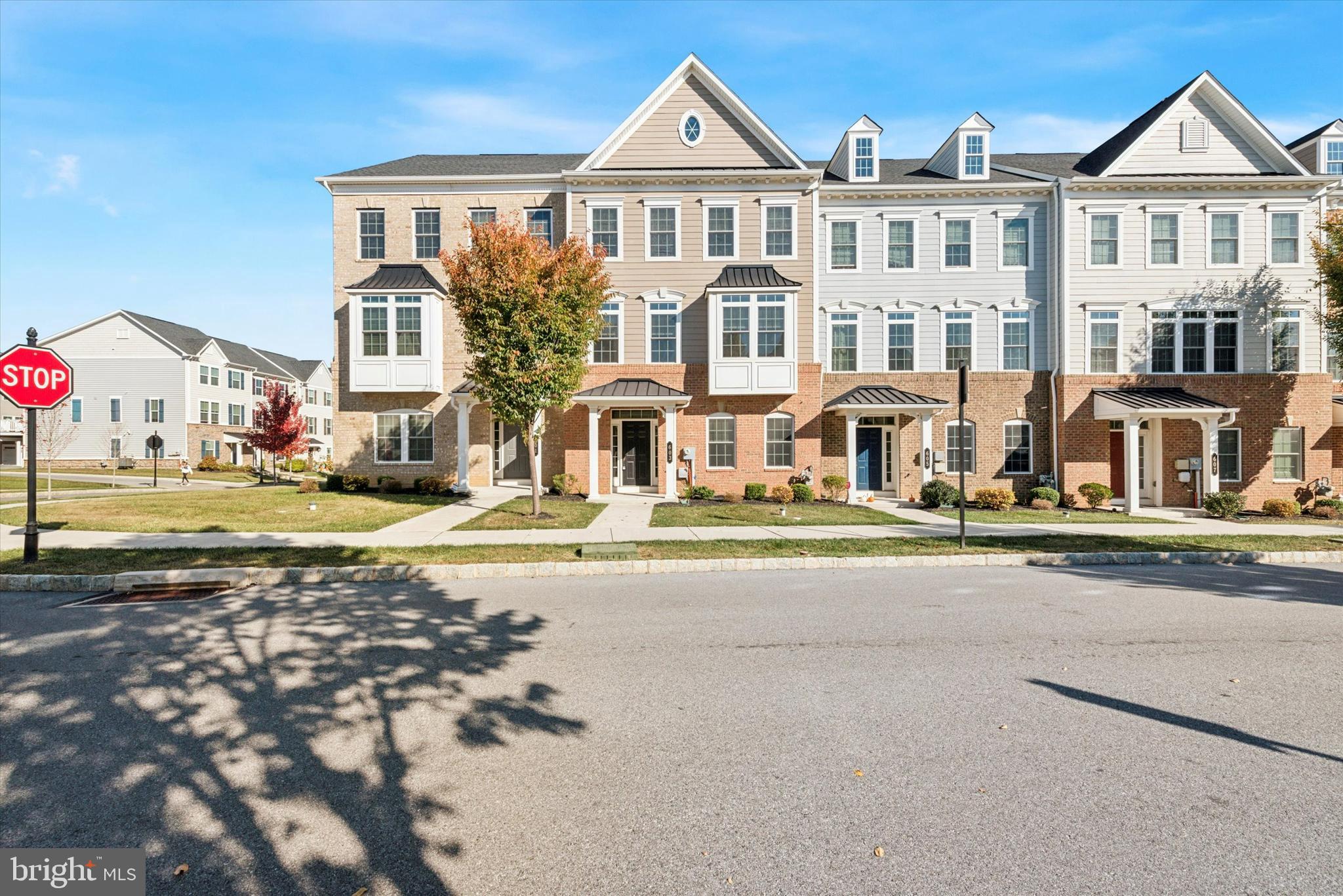 a front view of residential houses with street