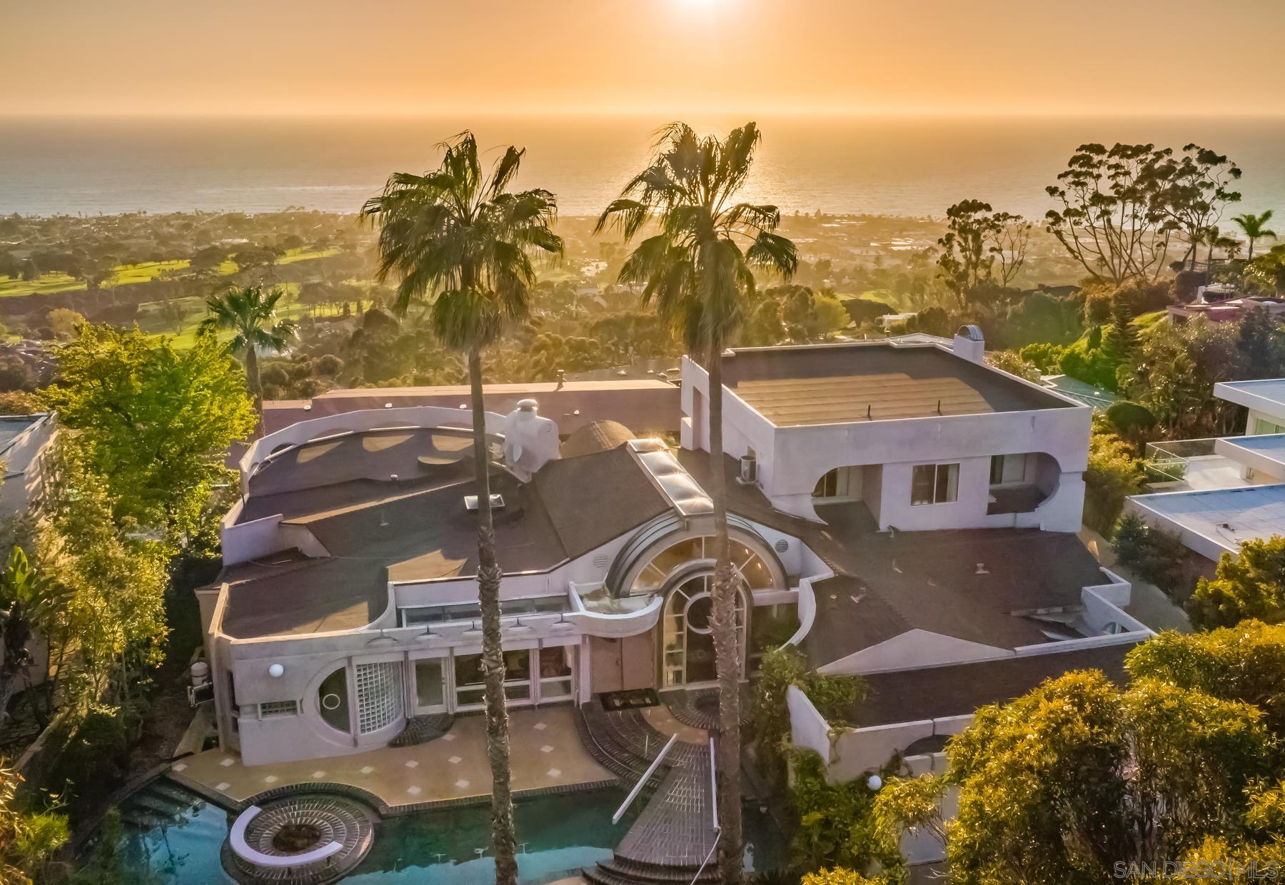 a view of a house with a ocean view