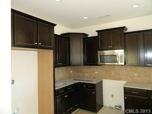 a kitchen with a sink and a refrigerator